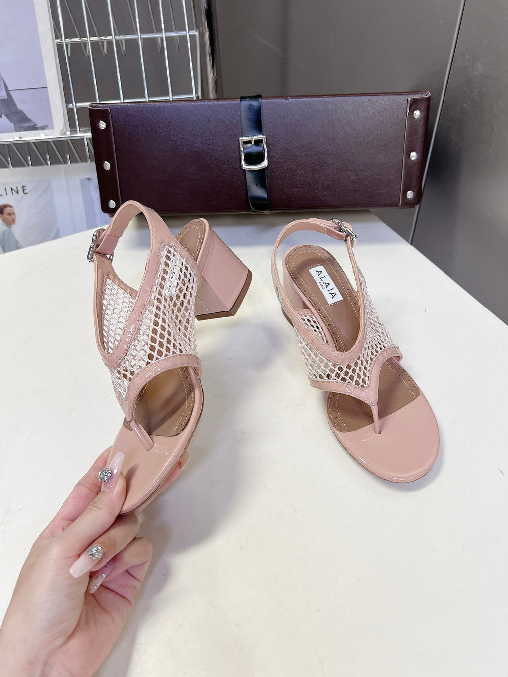 ALAIA 26S MESH THONG HEELS 55 MM IN PALE PINK PATENT CALFSKIN