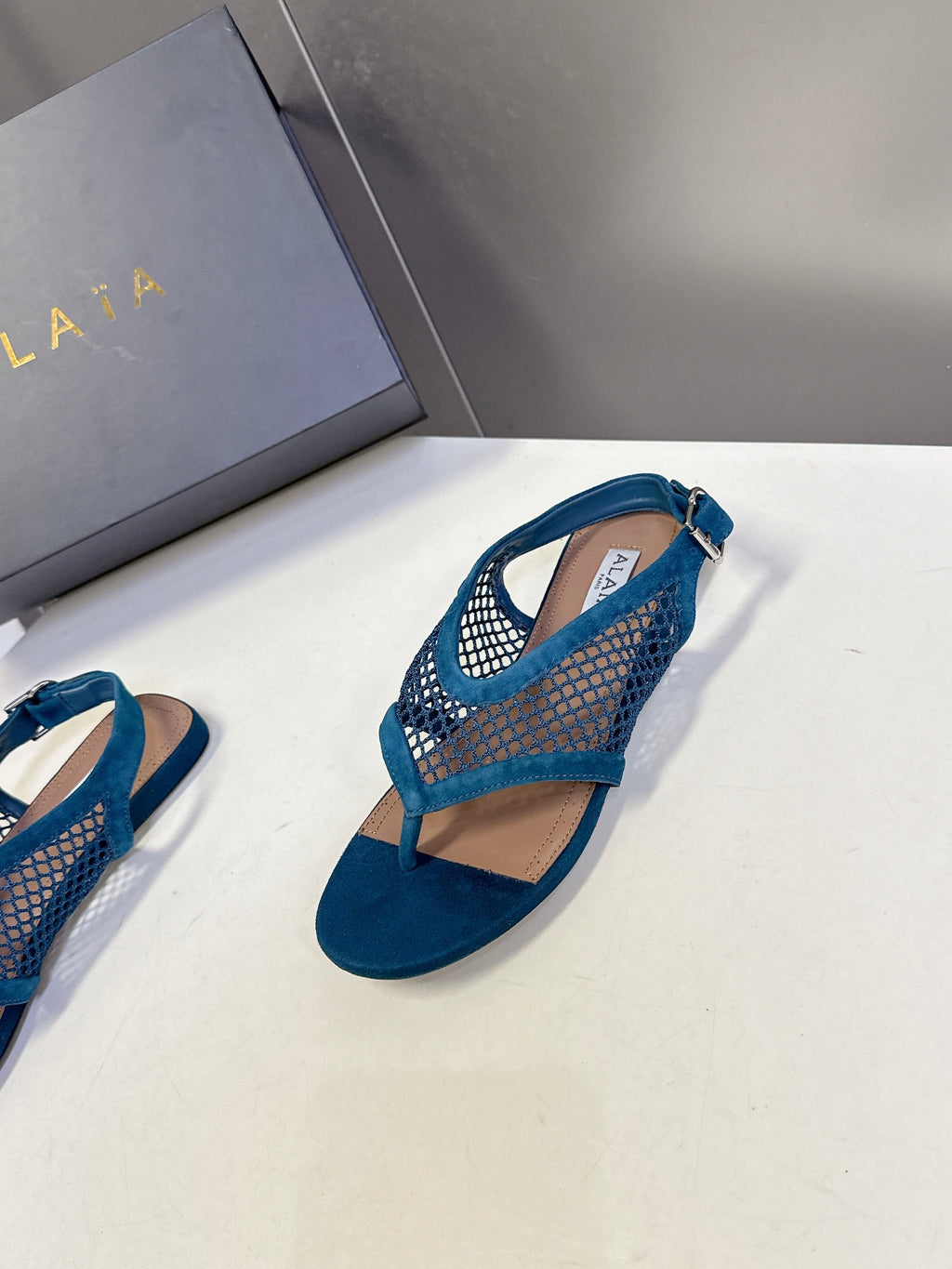 ALAIA 26S FLAT MESH THONG SANDALS IN PETROL BLUE SUEDE