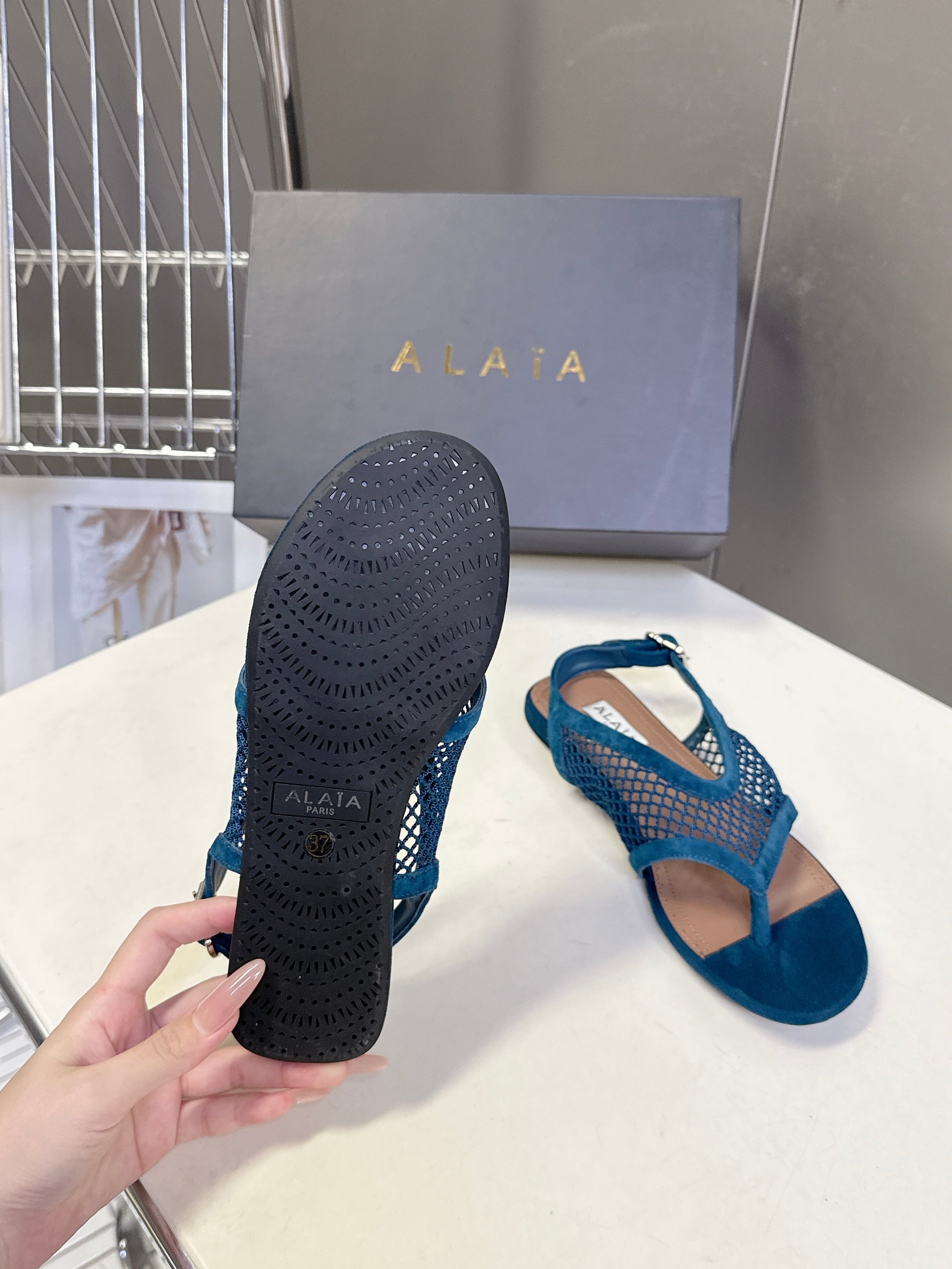 ALAIA 26S FLAT MESH THONG SANDALS IN PETROL BLUE SUEDE