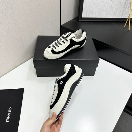 CHANEL SNEAKERS METIERS D-ART 26S IN BLACK AND WHITE SUEDE
