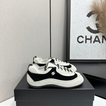 CHANEL SNEAKERS METIERS D-ART 26S IN BLACK AND WHITE SUEDE