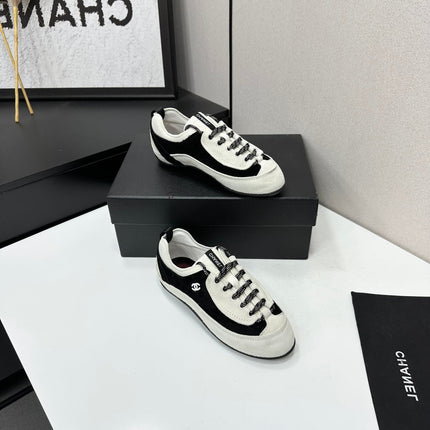CHANEL SNEAKERS METIERS D-ART 26S IN BLACK AND WHITE SUEDE