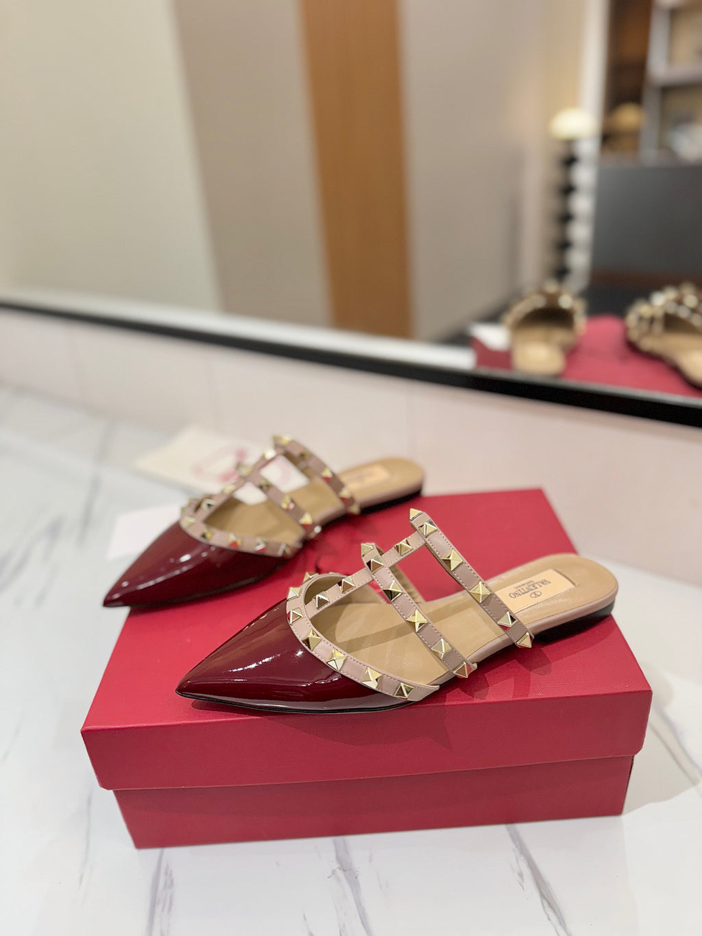 VALENTINO 26S STUDDED FLAT MULES IN DARK RED PATENT CALFSKIN