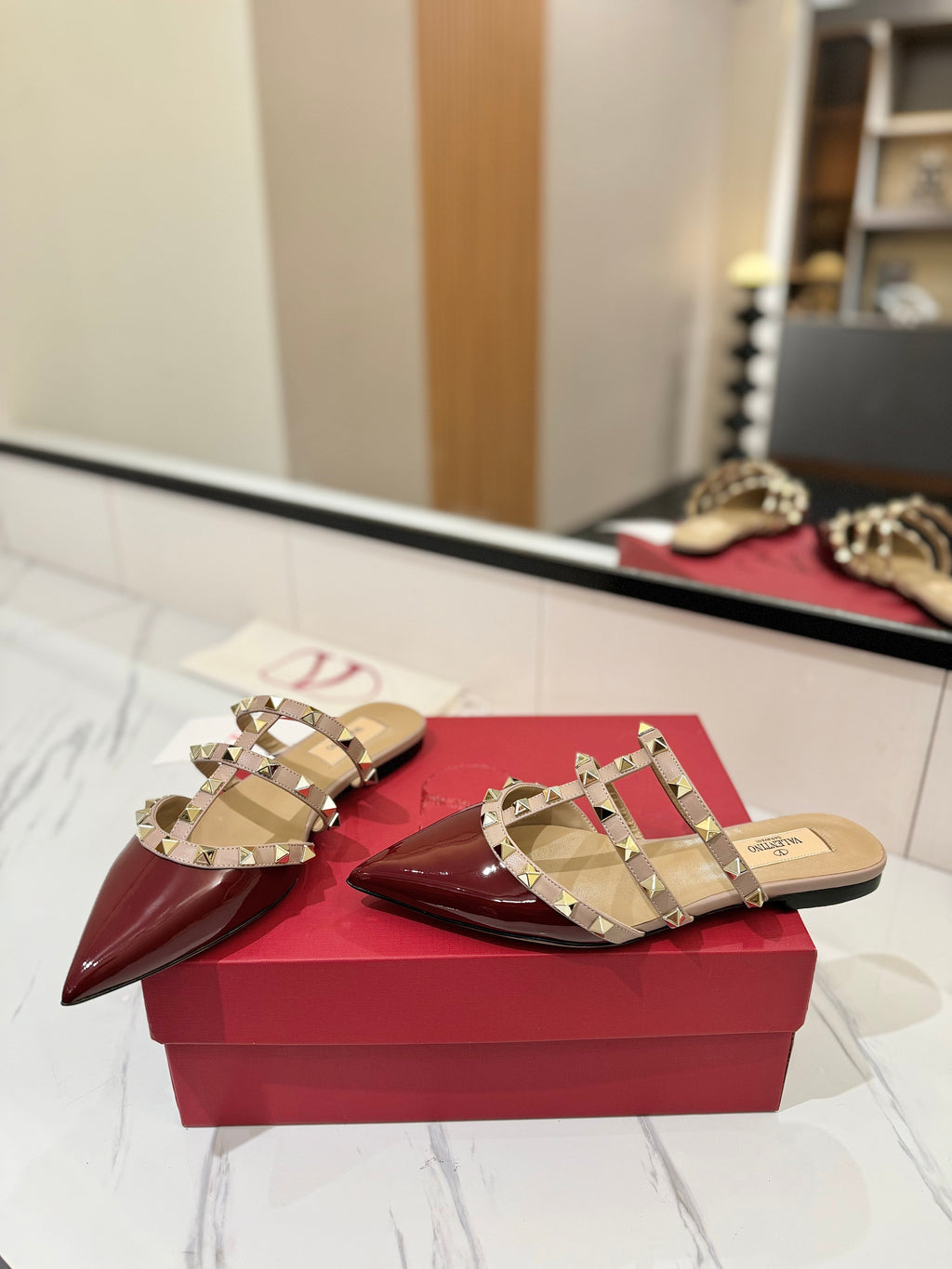 VALENTINO 26S STUDDED FLAT MULES IN DARK RED PATENT CALFSKIN
