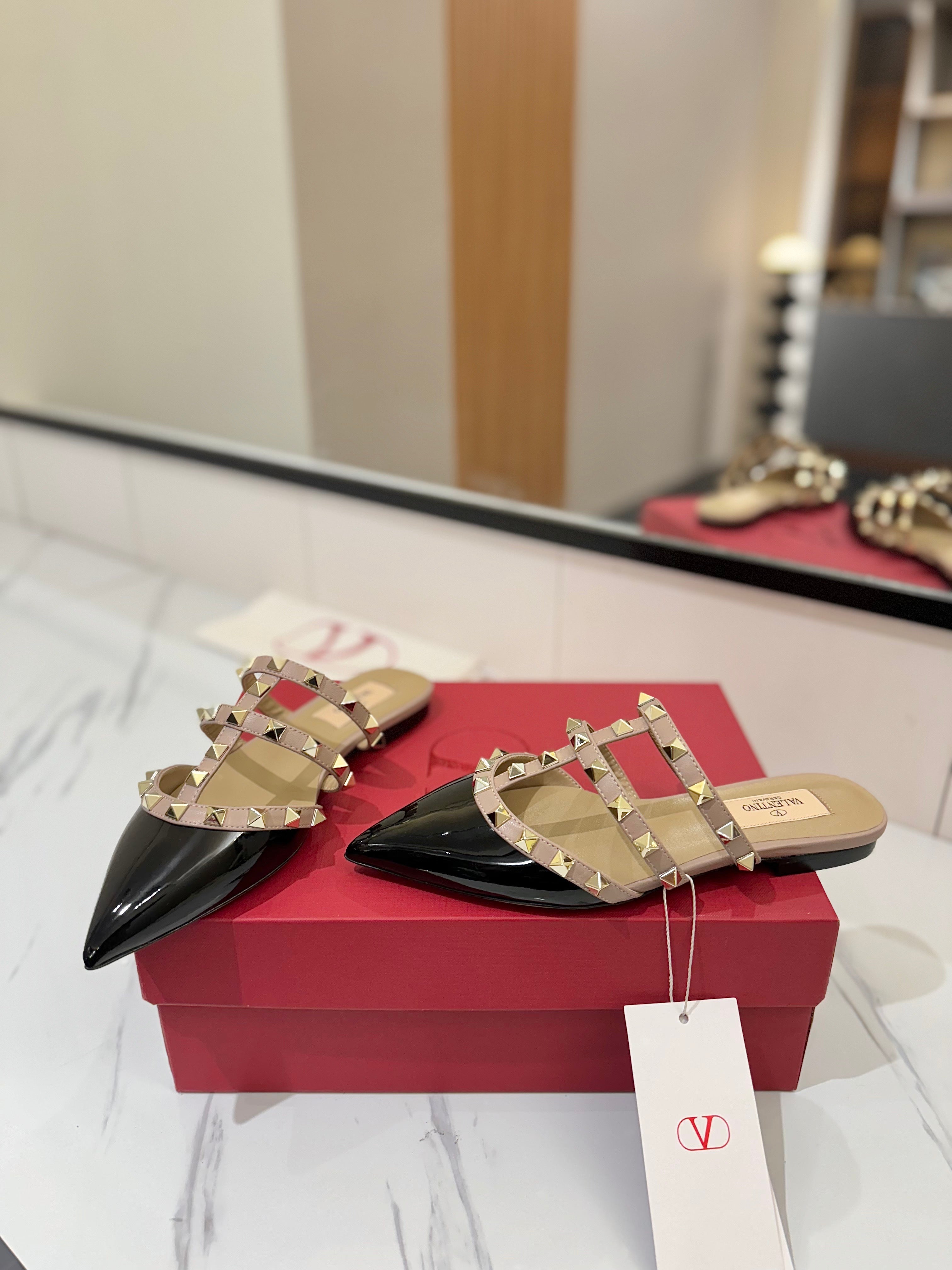 VALENTINO 26S STUDDED FLAT MULES IN BLACK PATENT CALFSKIN