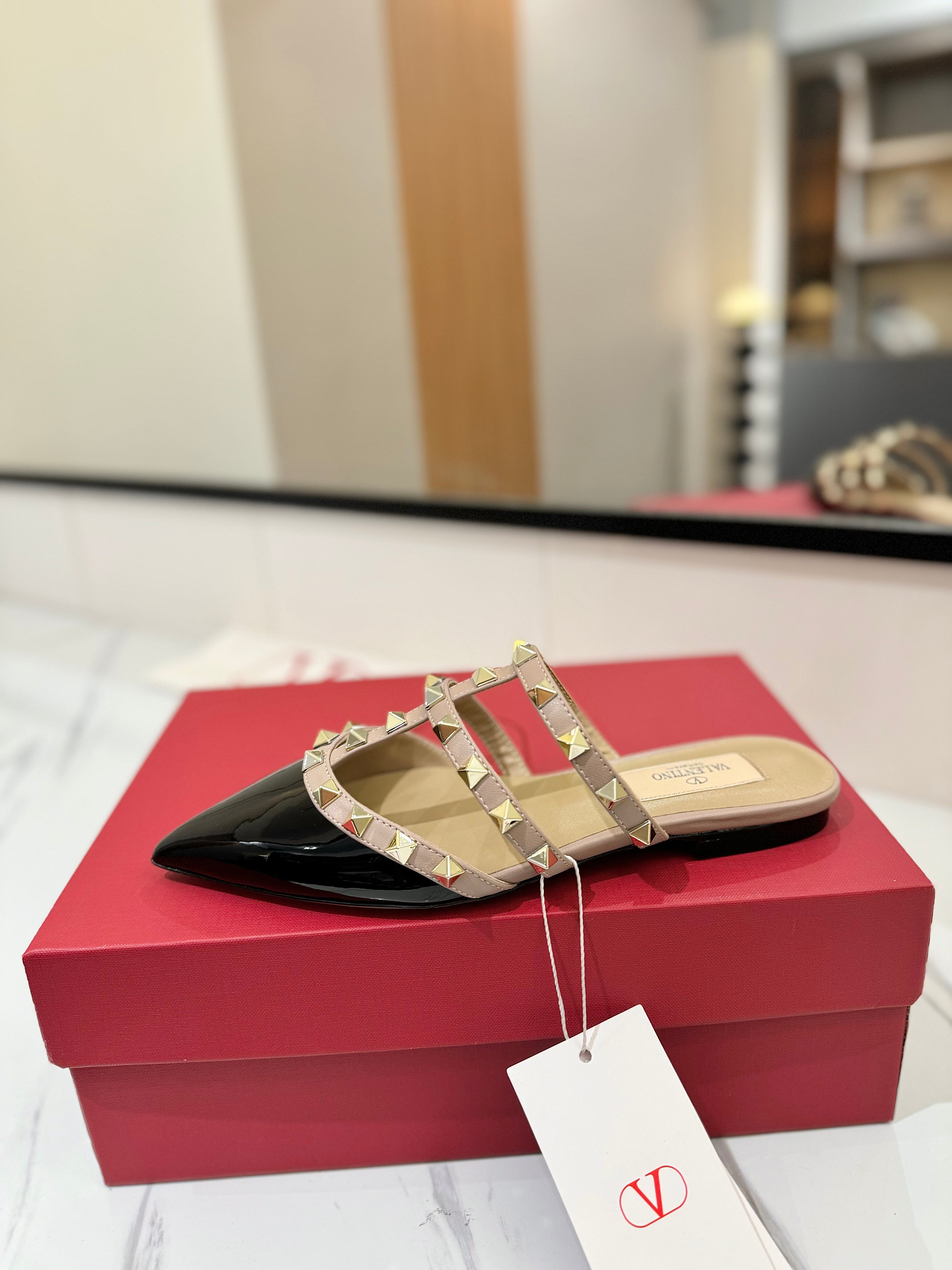 VALENTINO 26S STUDDED FLAT MULES IN BLACK PATENT CALFSKIN