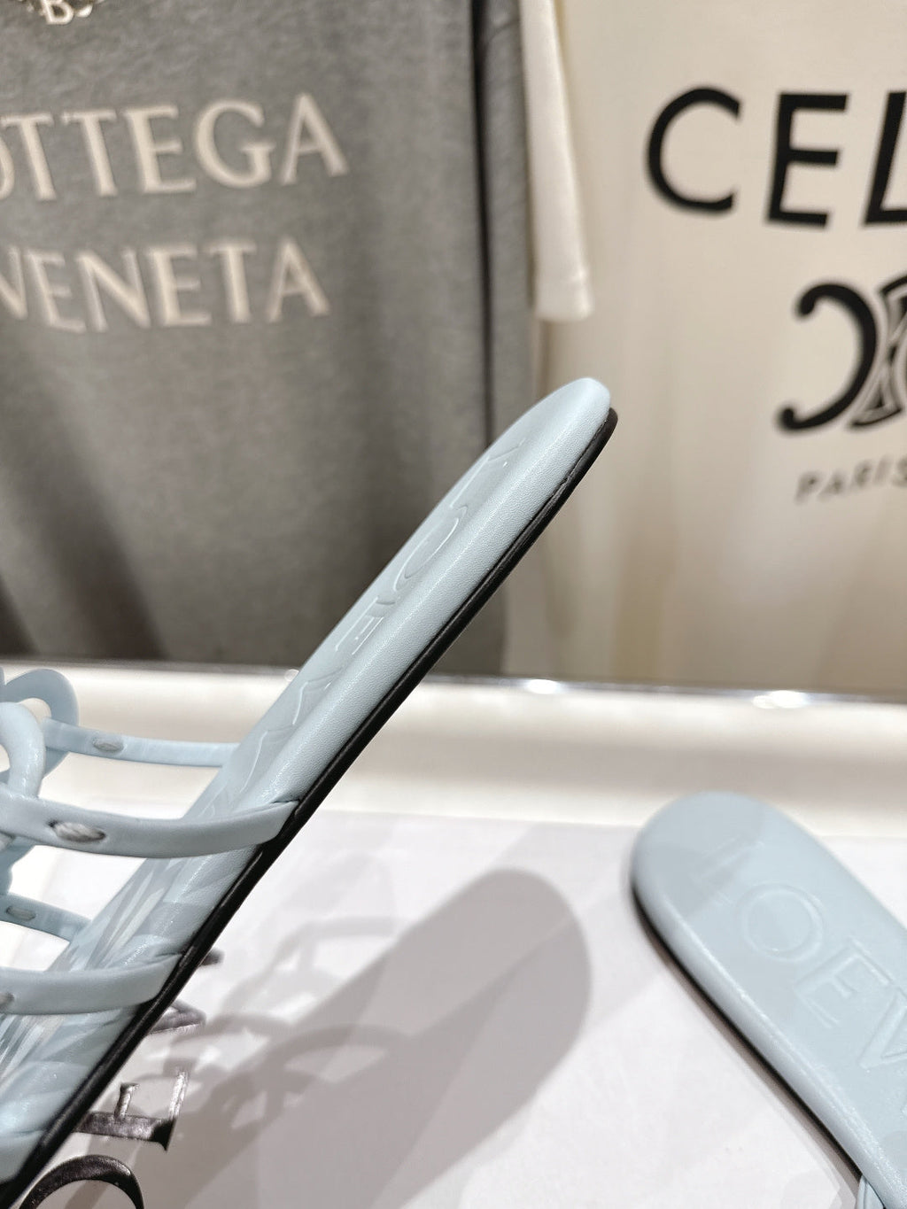 LOEWE 26S PETAL ANAGRAM SLIDE IN LIGHT BLUE CALFSKIN