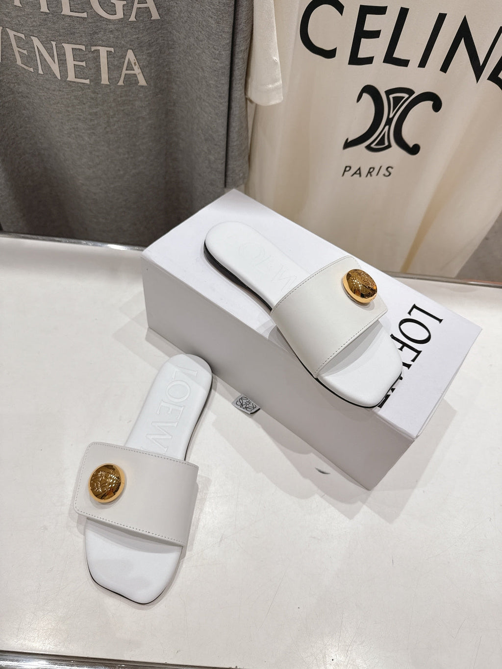 LOEWE 26S PEBBLE SLIDE IN WHITE CALFSKIN GOLD HARDWARE