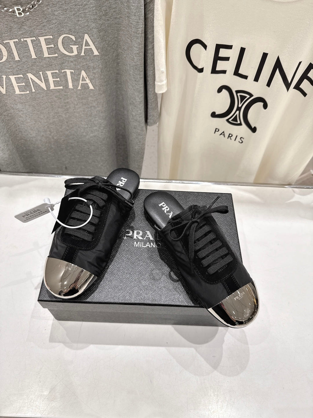 PRADA 25S MULES IN BLACK WITH METAL TOECAP