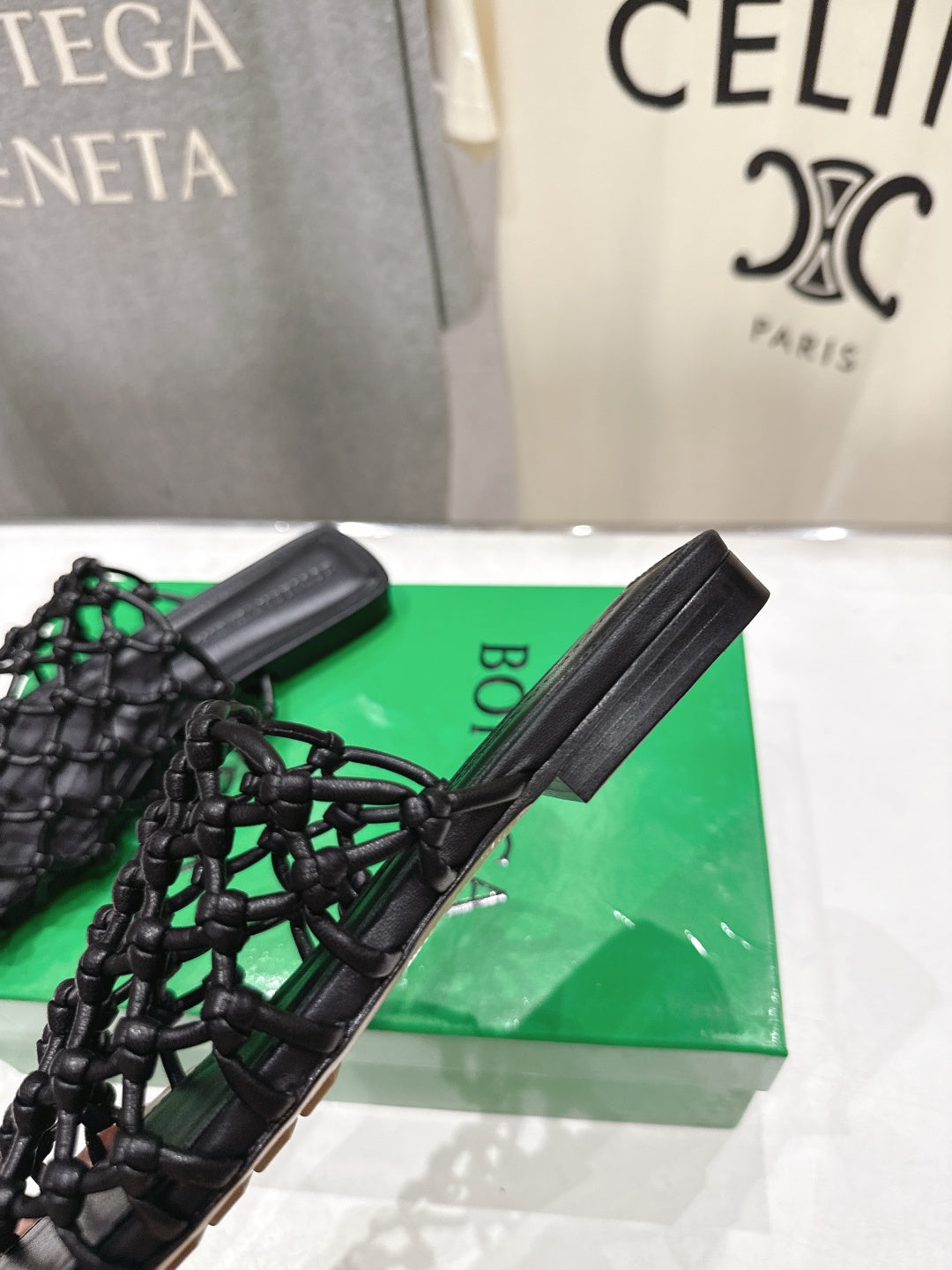 BOTTEGA VENETA 26S WOVEN MULES IN BLACK LAMBSKIN