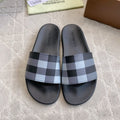 BURBERRY 26S CHECK PRINT RUBBER SLIDES IN BLACK CALFSKIN