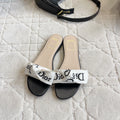 DIOR 26S DWAY SLIDE IN BLACK AND WHITE COTTON EMBOSSED LOGO