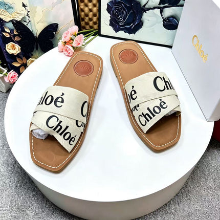 CHLOE 26S CRISSCROSS SLIDES IN BEIGE CANVAS