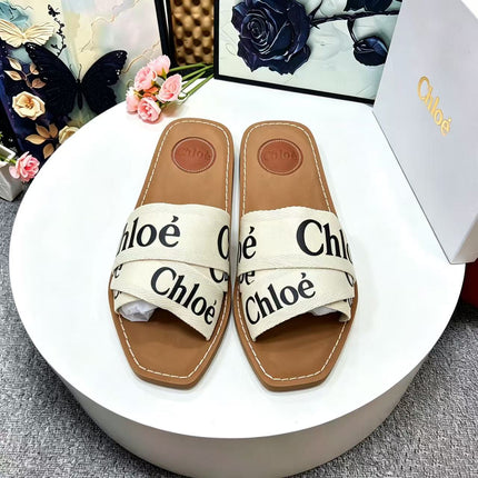CHLOE 26S CRISSCROSS SLIDES IN BEIGE CANVAS