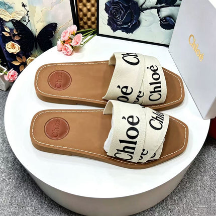 CHLOE 26S CRISSCROSS SLIDES IN BEIGE CANVAS