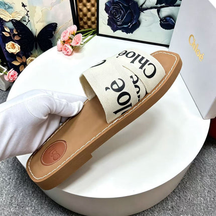 CHLOE 26S CRISSCROSS SLIDES IN BEIGE CANVAS