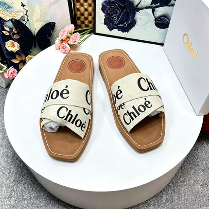 CHLOE 26S CRISSCROSS SLIDES IN BEIGE CANVAS