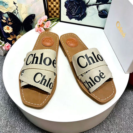 CHLOE 26S CRISSCROSS SLIDES IN BEIGE CANVAS