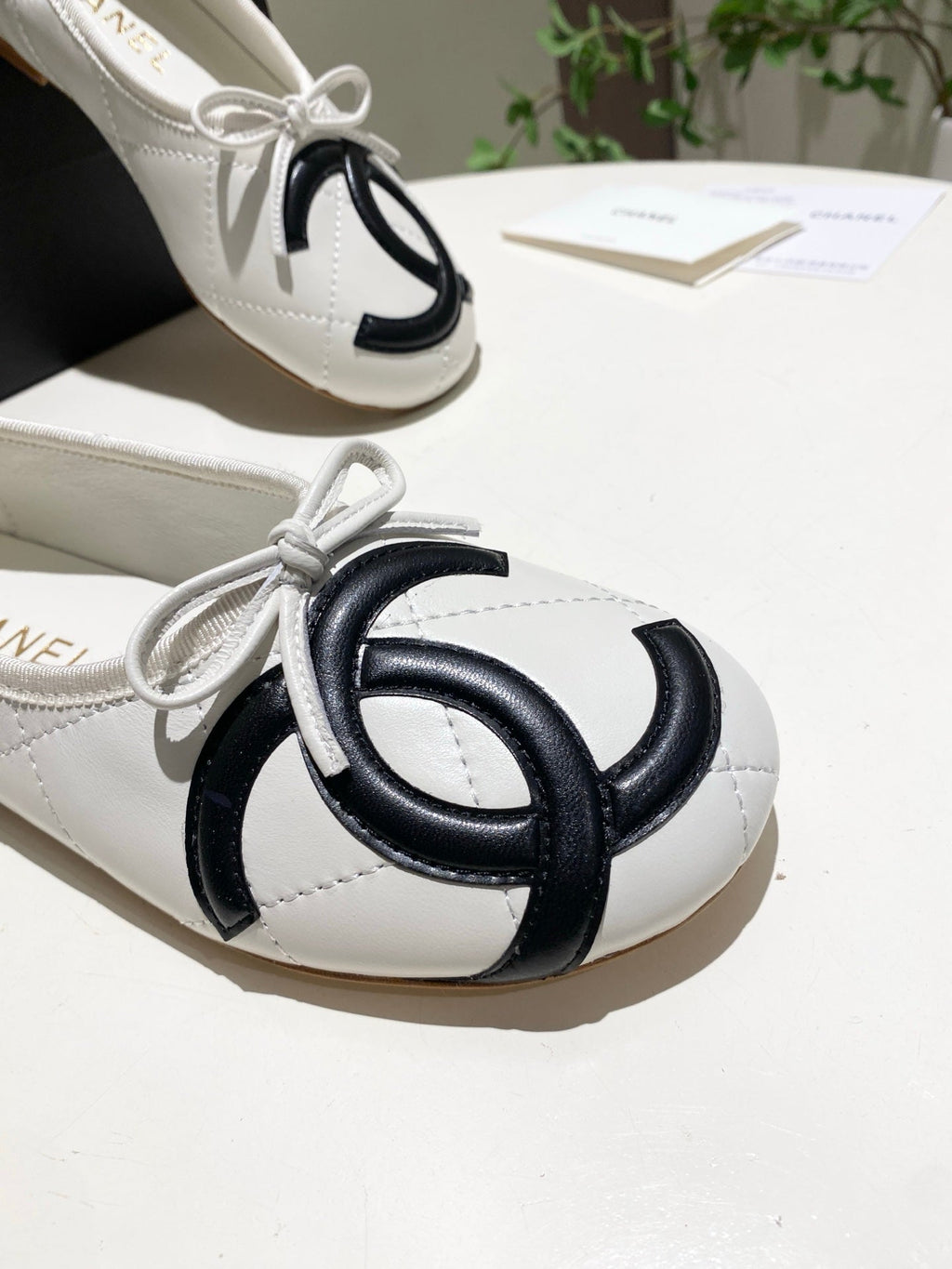CHANEL 26S FLATS IN WHITE LAMBSKIN WITH BOW