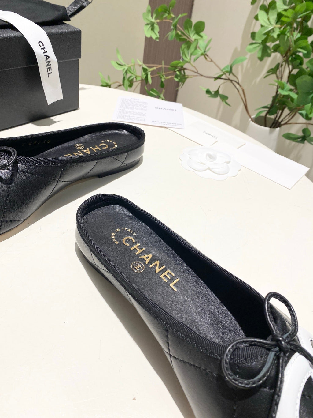 CHANEL 26S FLAT MULES IN BLACK LAMBSKIN