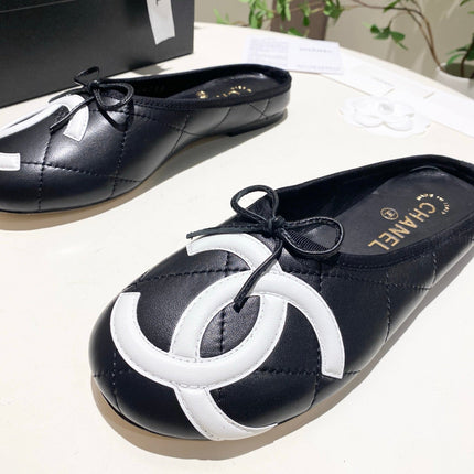 CHANEL 26S FLAT MULES IN BLACK LAMBSKIN