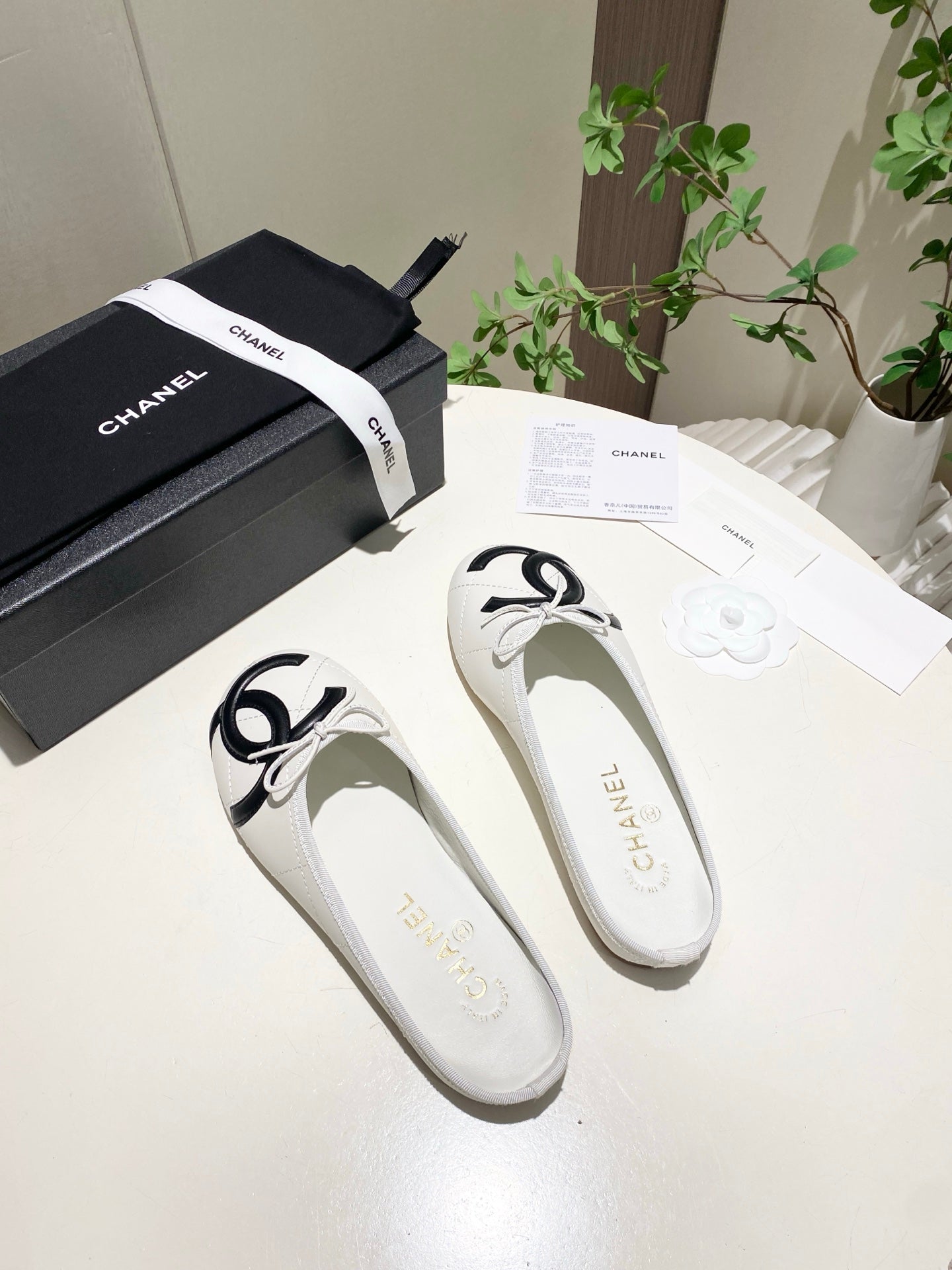 CHANEL 26S FLAT MULES IN WHITE LAMBSKIN