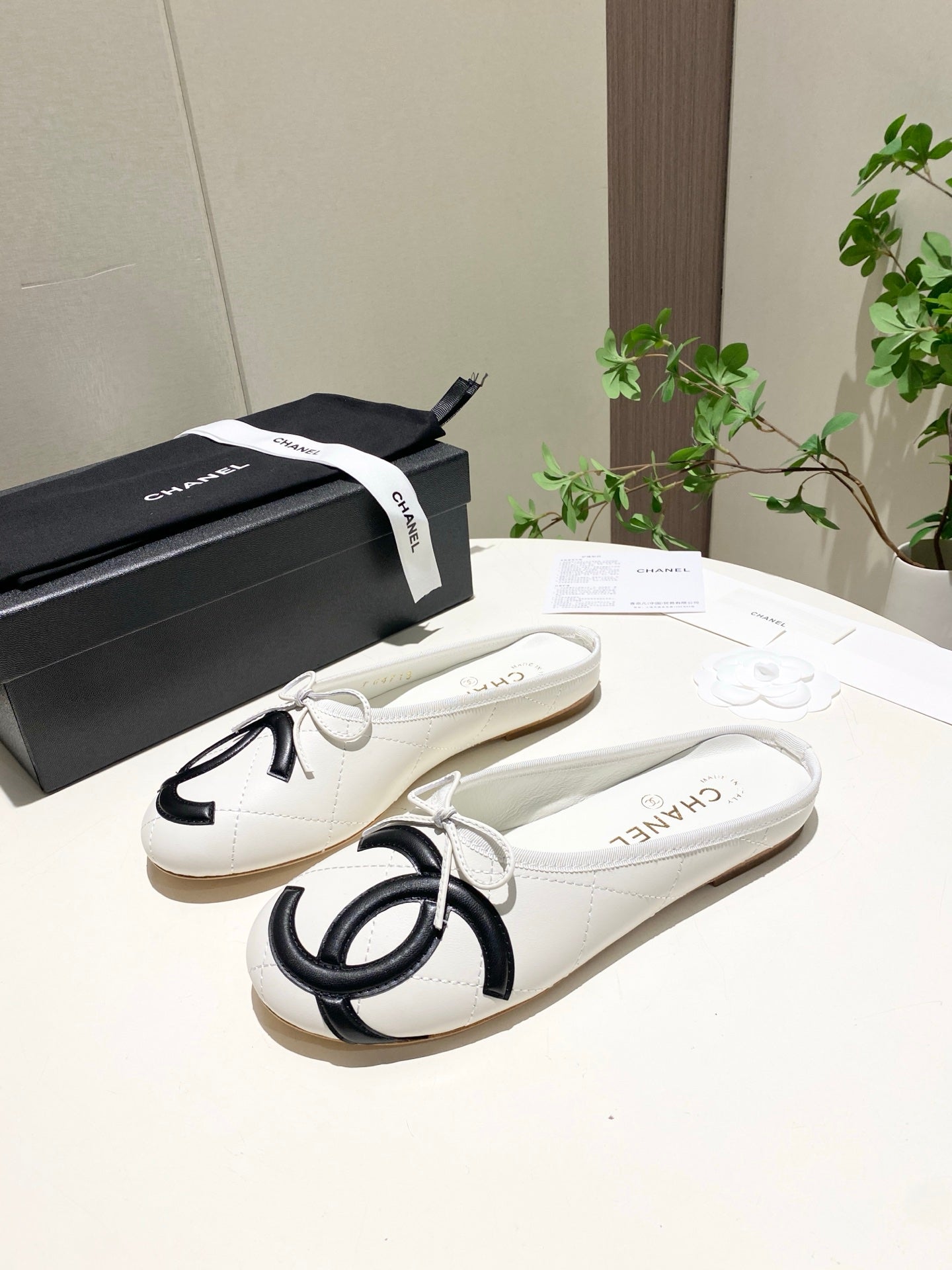 CHANEL 26S FLAT MULES IN WHITE LAMBSKIN
