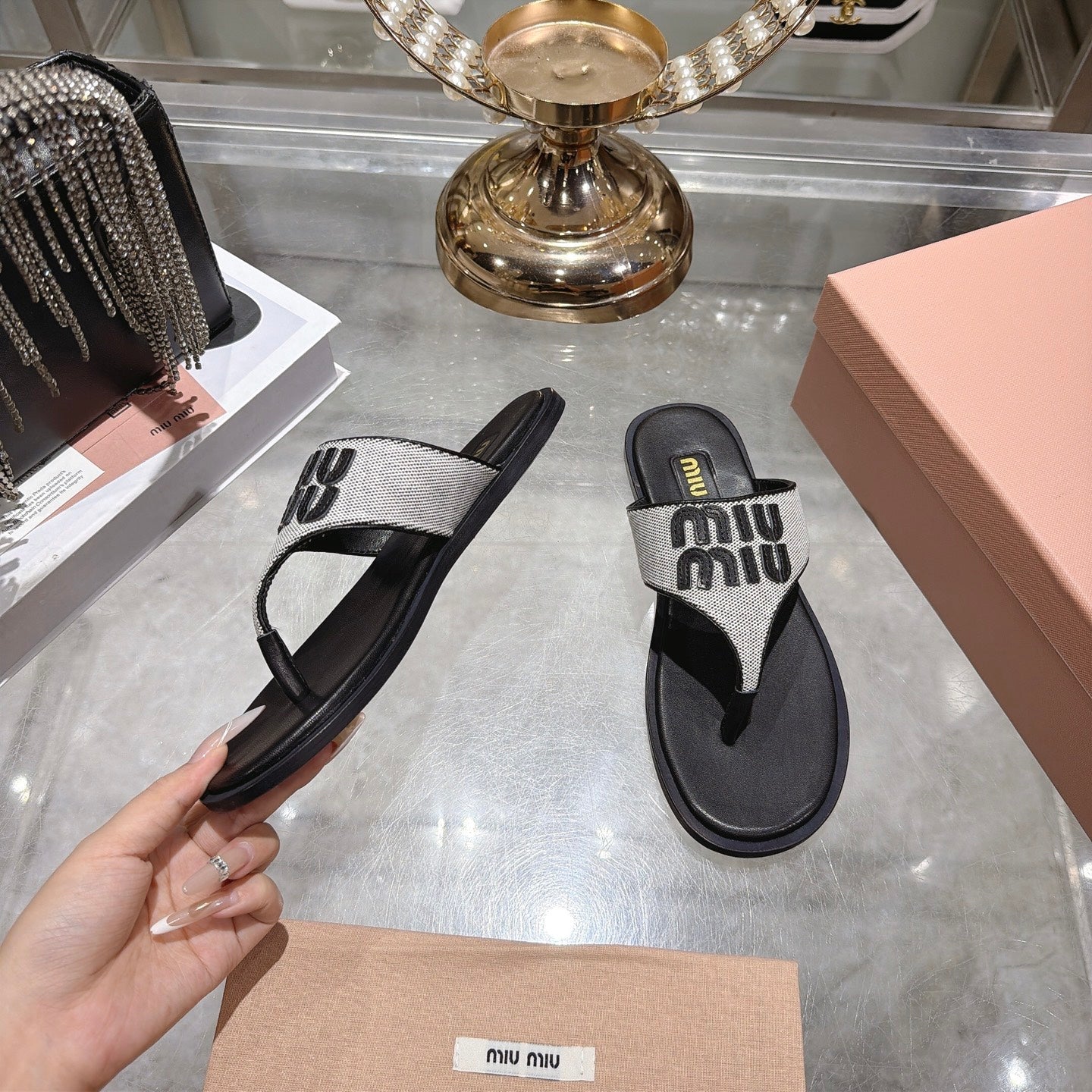 MIUMIU 26S THONG SANDALS IN WHITE CANVAS AND BLACK CALFSKIN LOGO