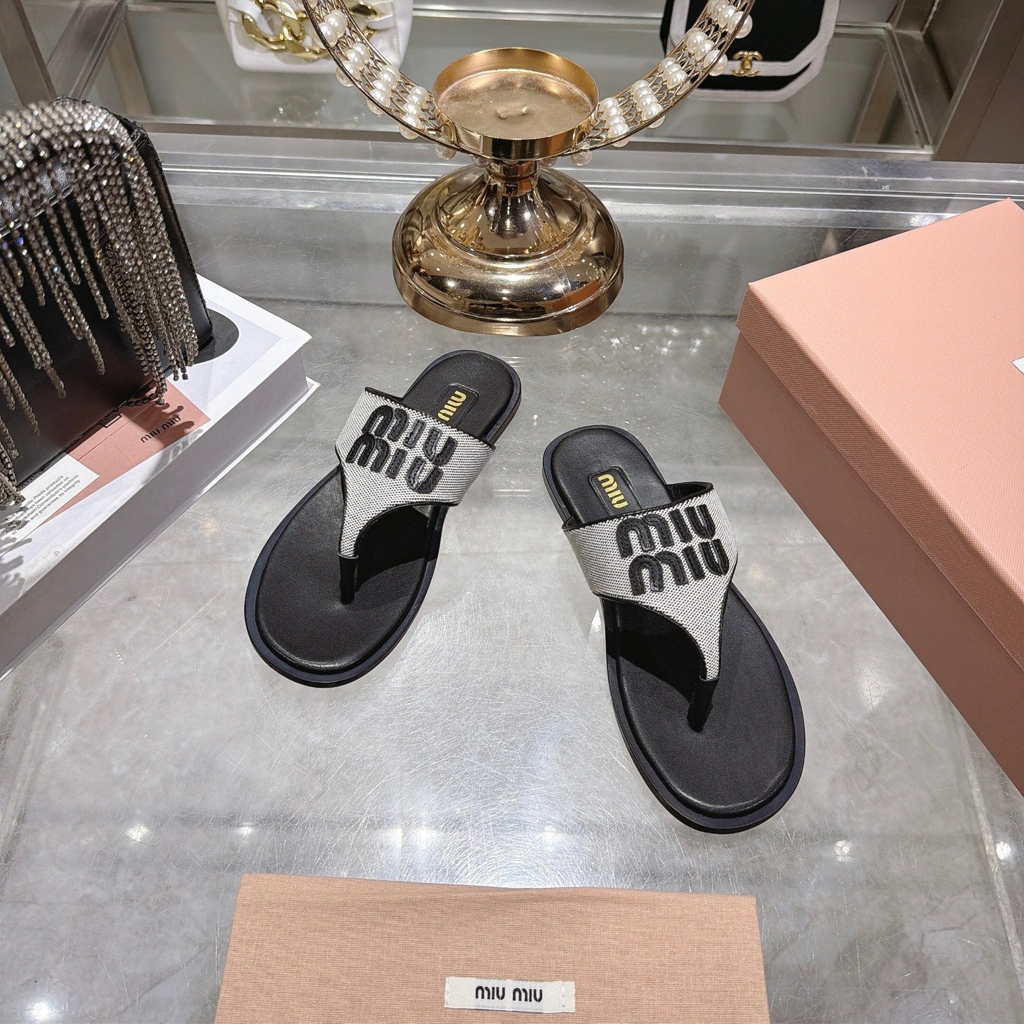 MIUMIU 26S THONG SANDALS IN WHITE CANVAS AND BLACK CALFSKIN LOGO