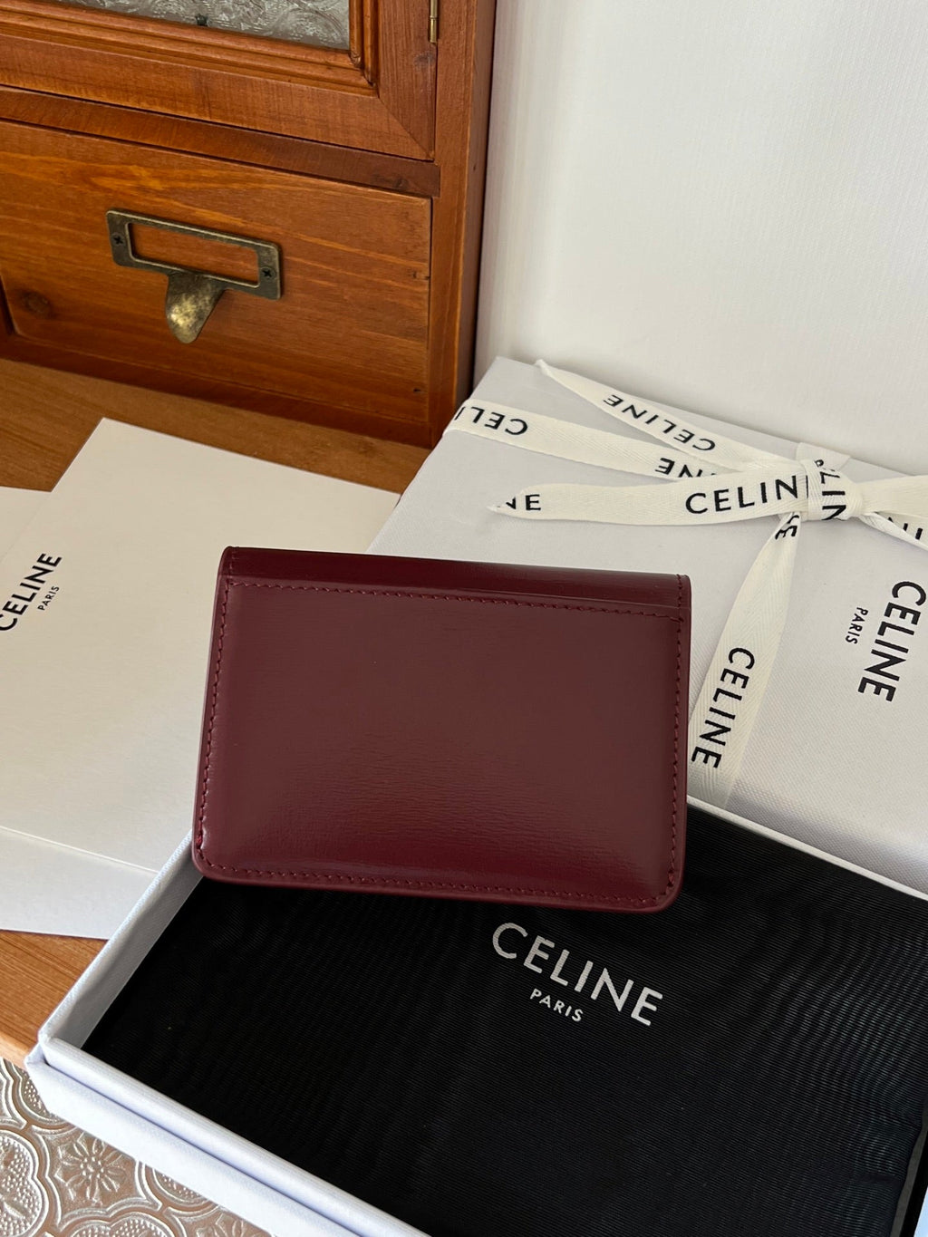 TRIOMPHE WALLET 10 IN BURGUNDY RED CALFSKIN GOLD HARDWARE