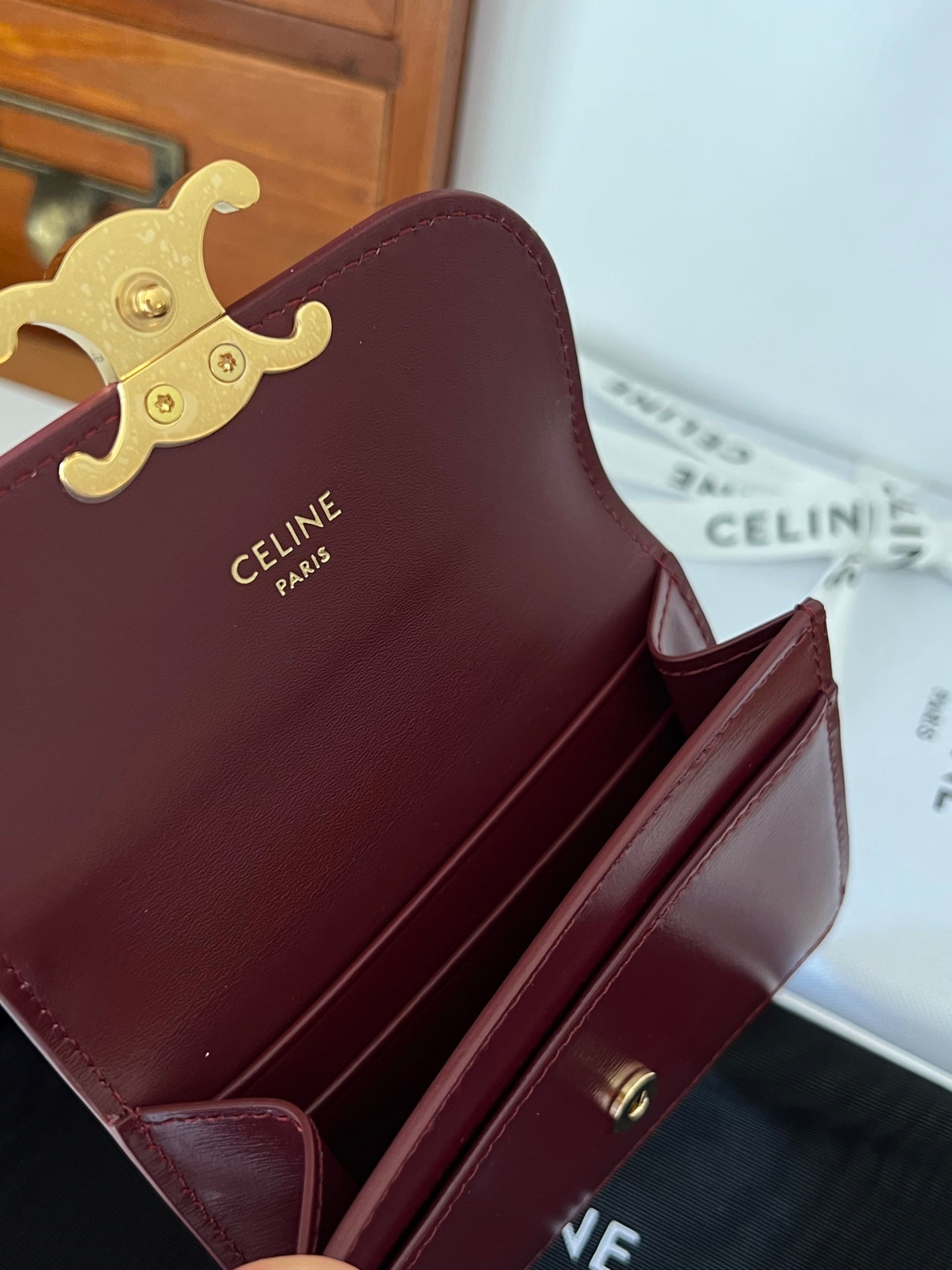 TRIOMPHE WALLET 10 IN BURGUNDY RED CALFSKIN GOLD HARDWARE