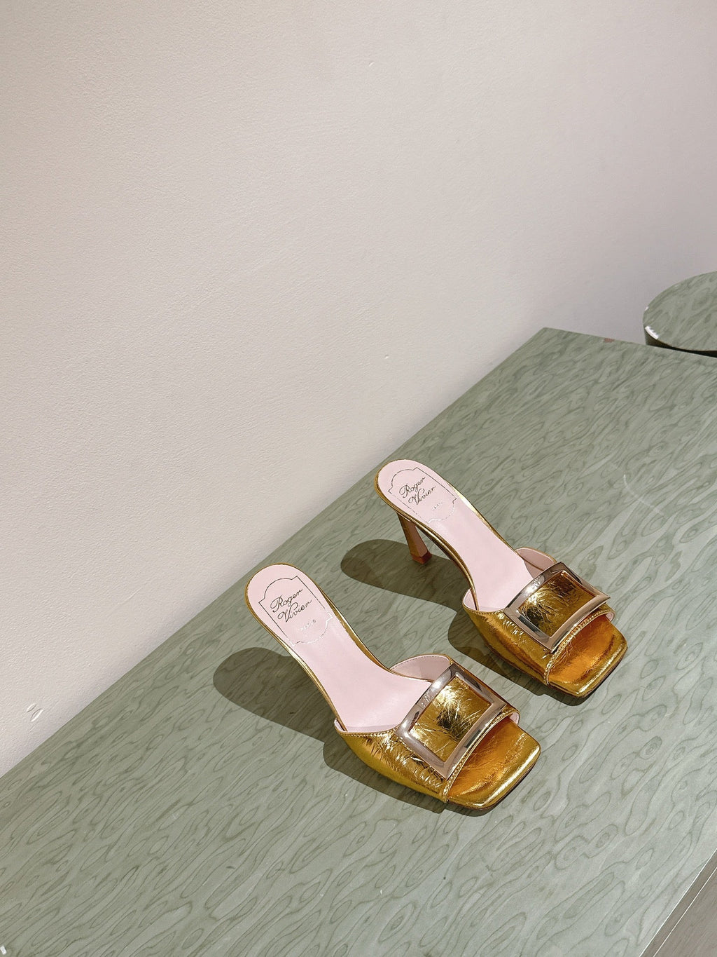 TRUMPET METALLIC MULES IN GOLD PATENT CALFSKIN