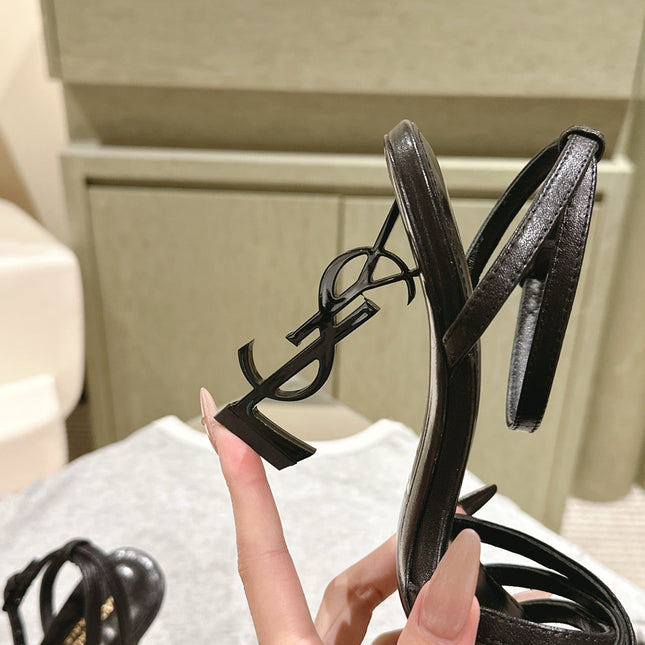 YSL 25S HIGH-HEEL SANDALS 100 MM IN BLACK LAMBSKIN WITH YSL LOGO HEEL DESIGN