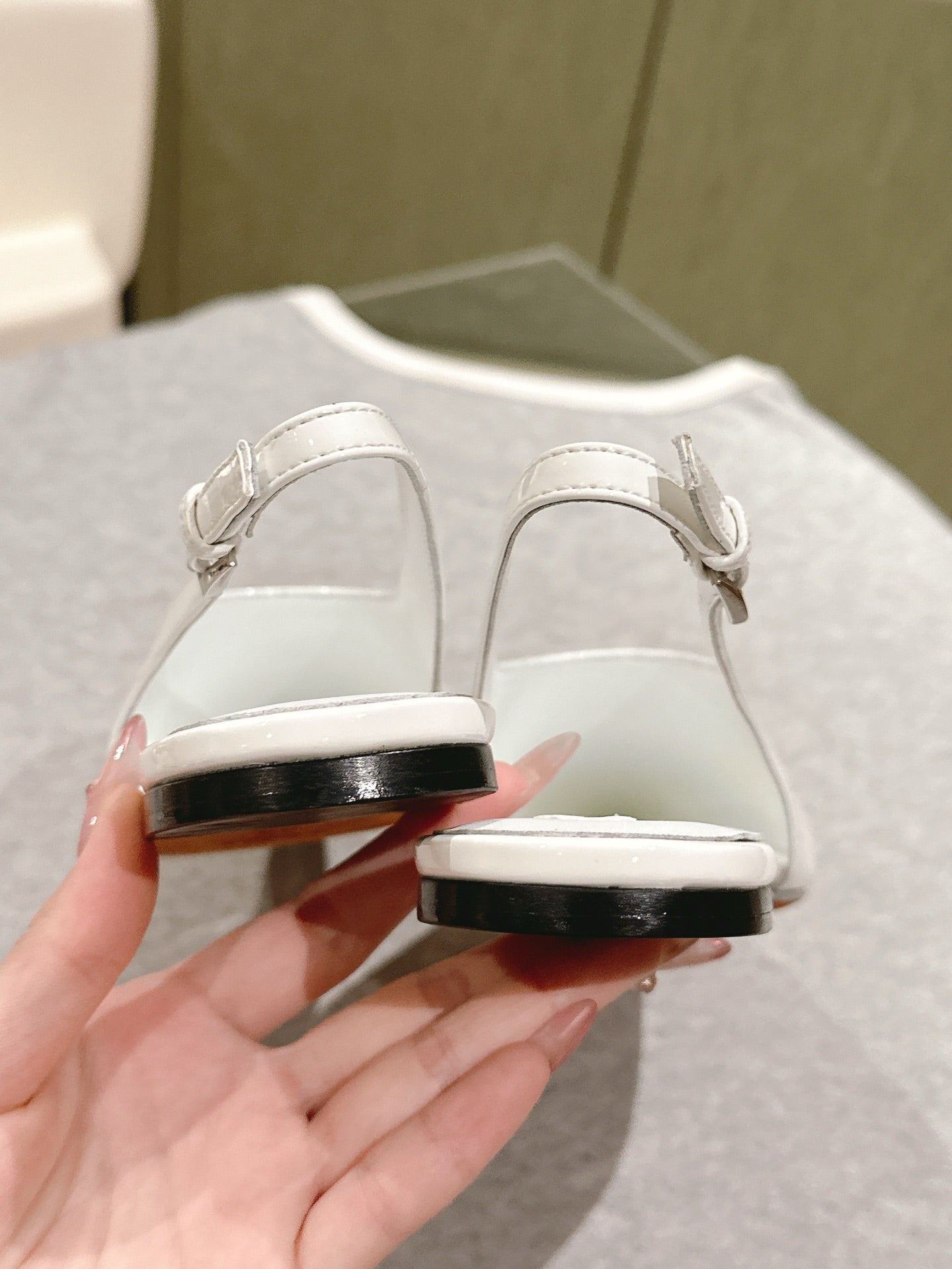 ALAIA SLINGBACK 25S IN WHITE PATENT LEATHER