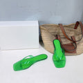 THE ROW 26S SQUARE TOE THONG SANDALS IN TRANSLUCENT GREEN PVC WITH SILVER FOOTBED
