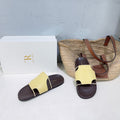 THE ROW 26S STRAP SLIDES IN LIGHT YELLOW CALFSKIN