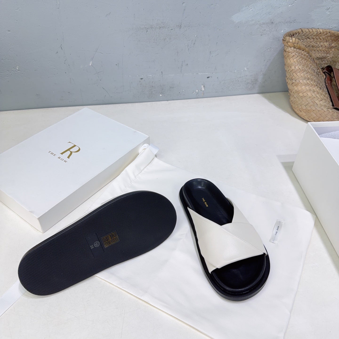 THE ROW 26S CROSS STRAP SLIDES IN IVORY WHITE CALFSKIN WITH BLACK FOOTBED