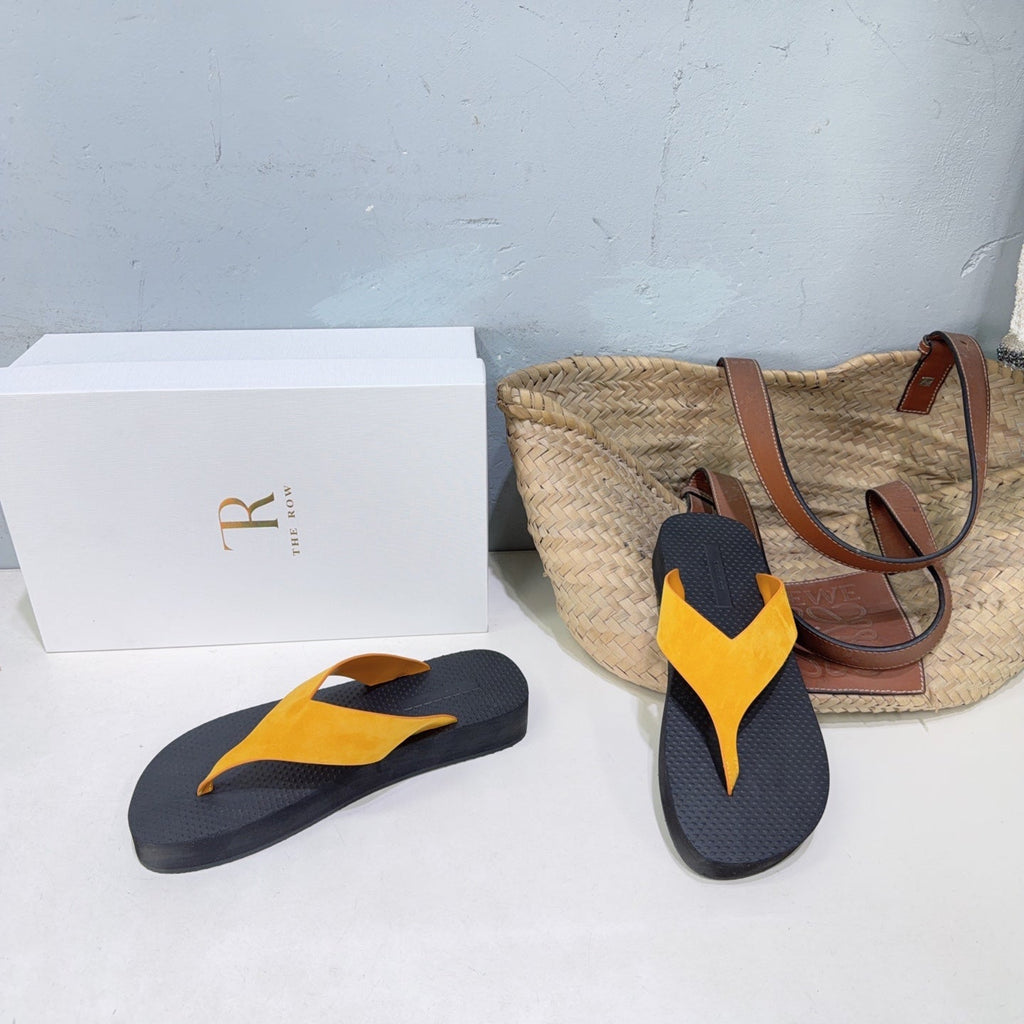 THE ROW 26S THONG SANDALS IN BLACK RUBBER  WITH GOLD YELLOW STRAPS