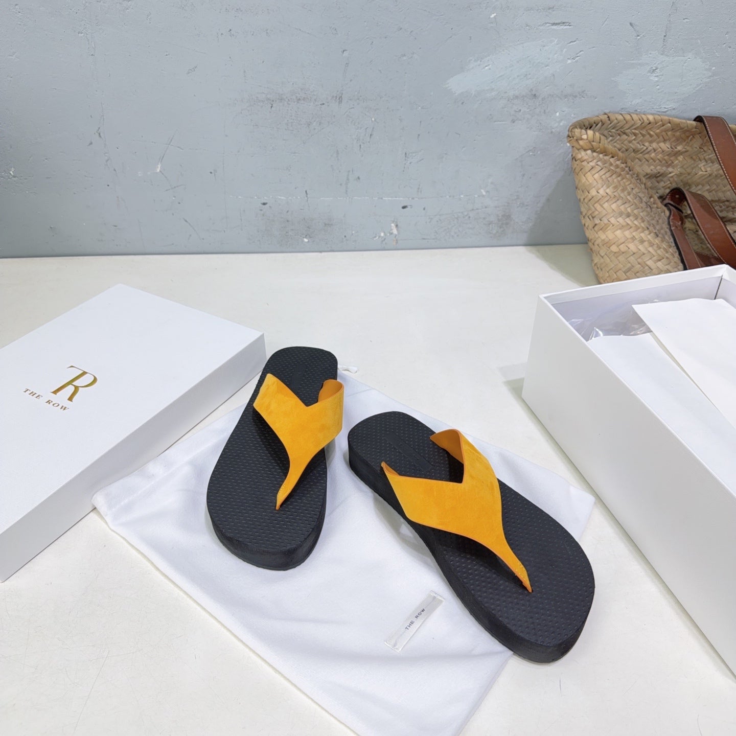 THE ROW 26S THONG SANDALS IN BLACK RUBBER  WITH GOLD YELLOW STRAPS