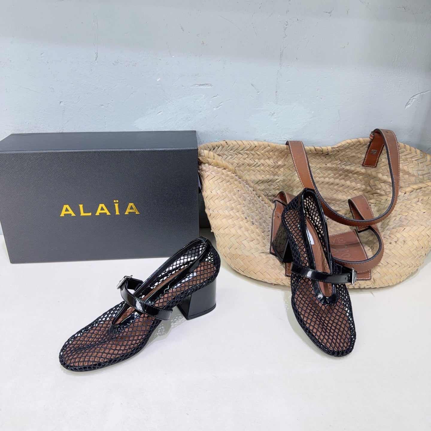 ALAIA 26S HIGH-HEEL MARY JANES 50 MM IN BLACK WOVEN MESH
