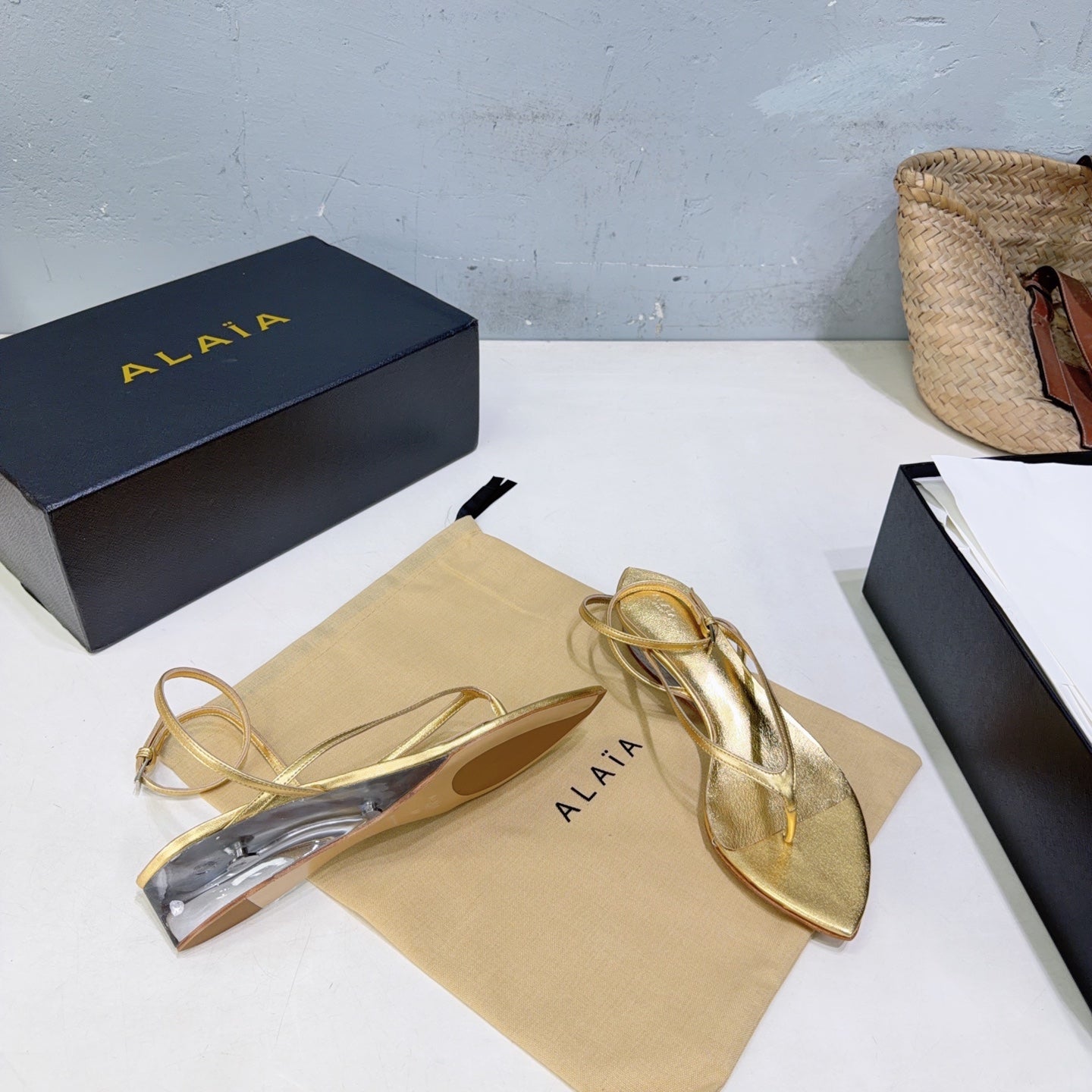ALAIA 26S THONG SANDALS IN GOLD CALFSKIN