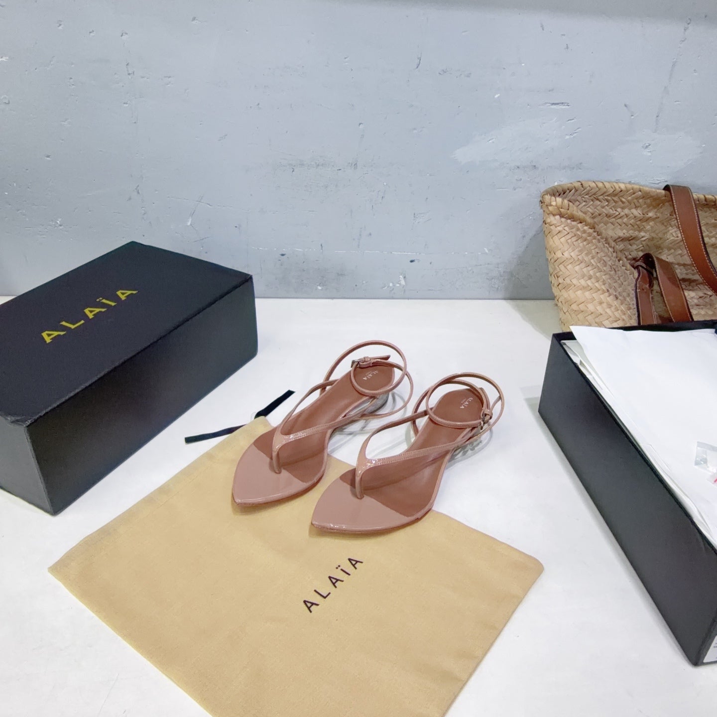 ALAIA 26S THONG SANDALS IN NUDE CALFSKIN