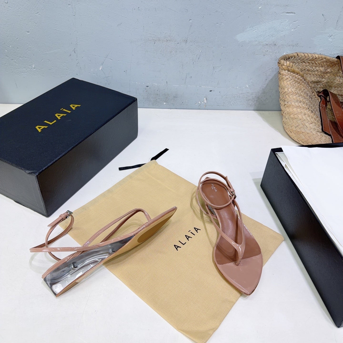 ALAIA 26S THONG SANDALS IN NUDE CALFSKIN