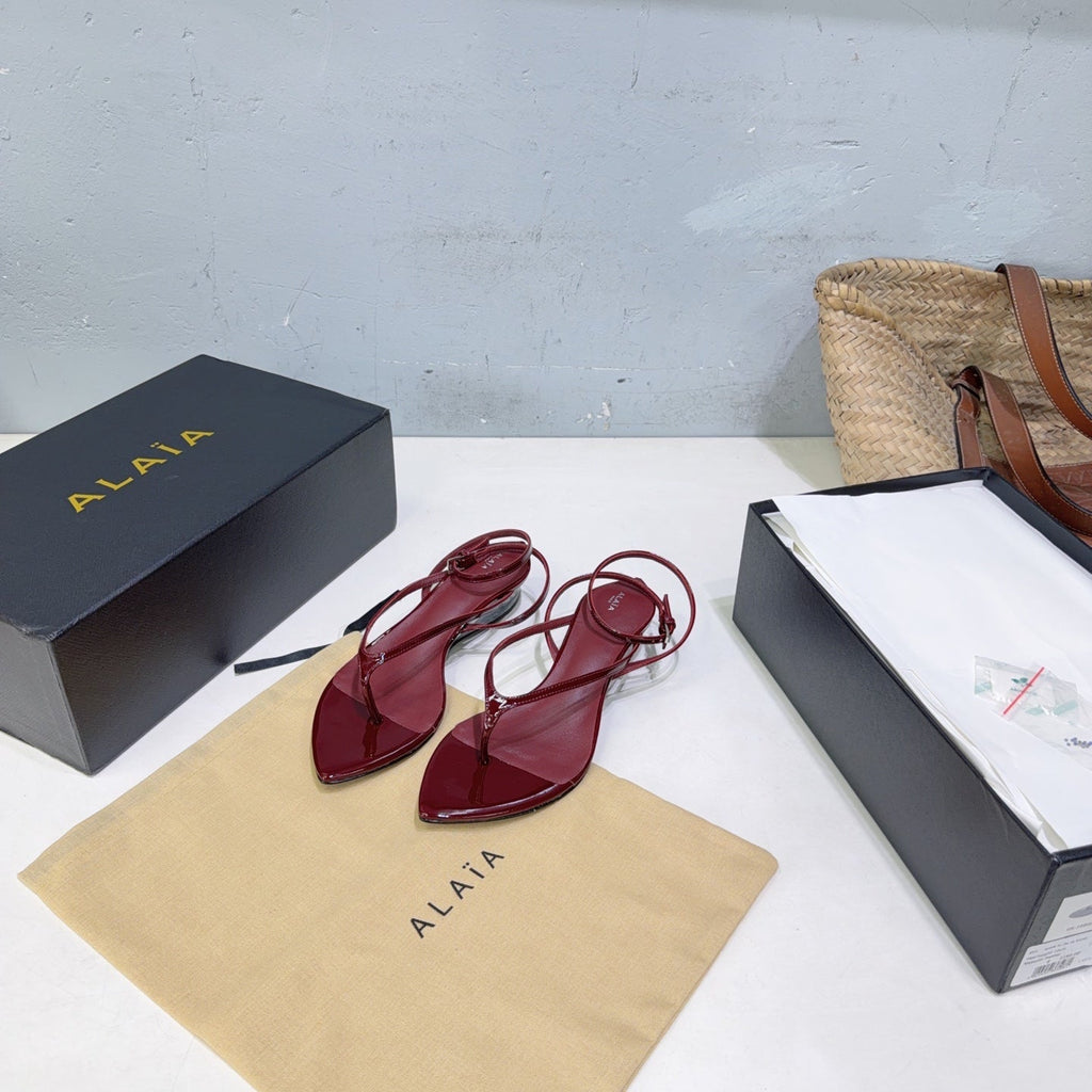 ALAIA 26S THONG SANDALS IN DARK RED CALFSKIN