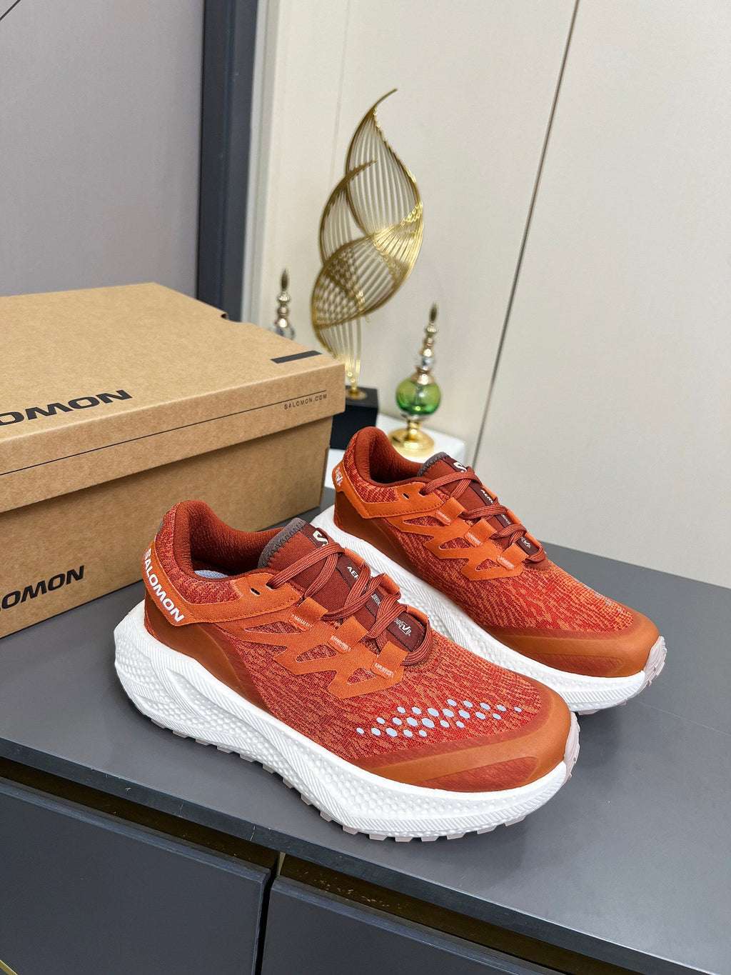 ALO 25S SALOMON ODYSSEY ELMT SNEAKER 45 MM IN DARK ORANGE FABRIC
