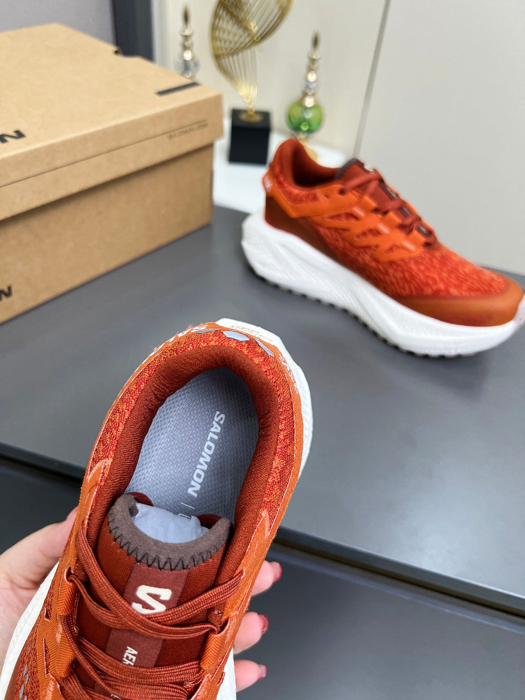 ALO 25S SALOMON ODYSSEY ELMT SNEAKER 45 MM IN DARK ORANGE FABRIC