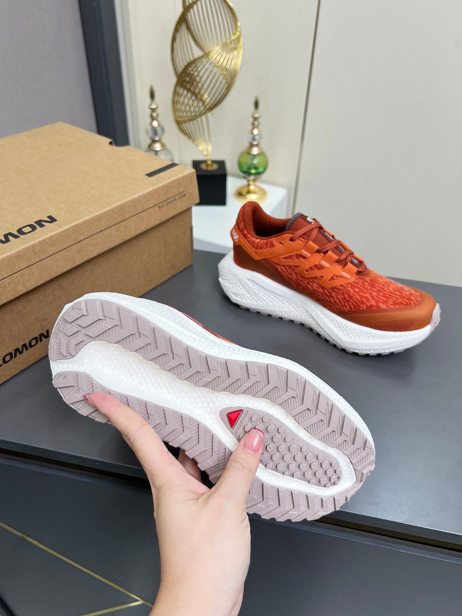 ALO 25S SALOMON ODYSSEY ELMT SNEAKER 45 MM IN DARK ORANGE FABRIC