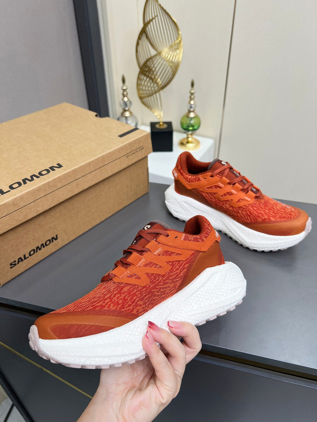 ALO 25S SALOMON ODYSSEY ELMT SNEAKER 45 MM IN DARK ORANGE FABRIC