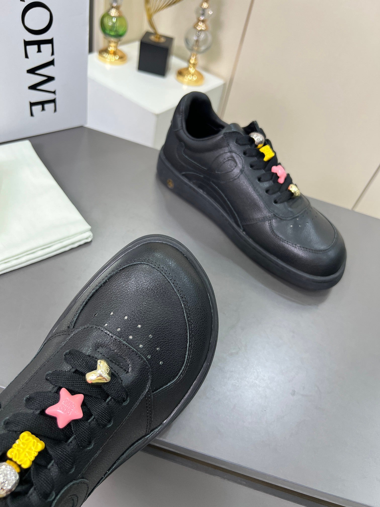 LOEWE 26S LOW TOP SNEAKERS IN BLACK CALFSKIN WITH CHARM LACES