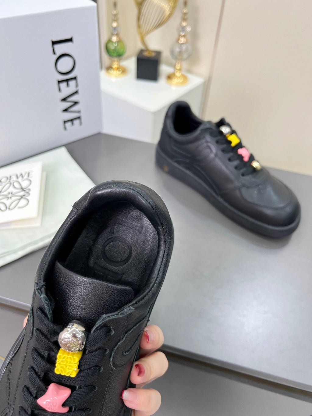 LOEWE 26S LOW TOP SNEAKERS IN BLACK CALFSKIN WITH CHARM LACES